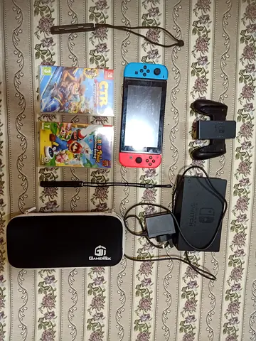 Nintendo Switch console with dock, joy-cons, case and 2 games
