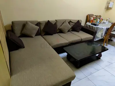 L-shaped fabric sofa with chaise, seats 4-5, good condition