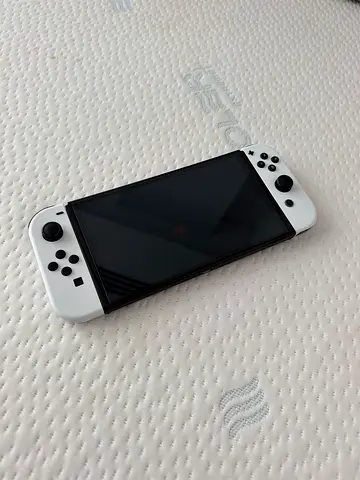 White nintendo switch oled with all accessories and nintendo switch online code (negotiable price)