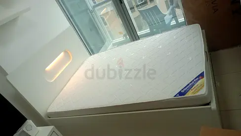 Queen-size bed and mattress with storage - good condition
