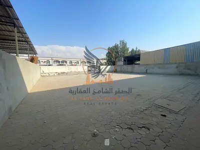Yard for rent in Jurf Industrial 3 on a main road, 5,000 sq ft, 30 kW electricity, AED 150,000 payable in 4 installments