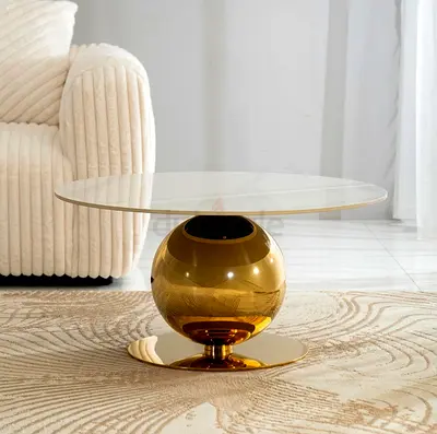 Modern round glass-top coffee table with gold spherical base