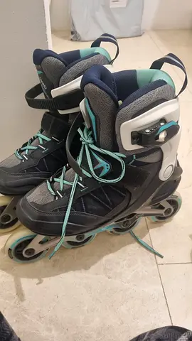 rollerblades / adjustable adult skates with full protective gear - size approx EU 40