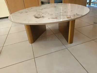 Oval shape marble-top coffee table with gold base