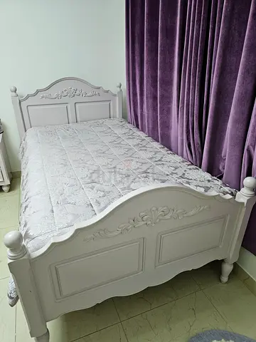 Light purple/ Lavender Single Bed with Ornate Carved Headboard, matching side table and desk.