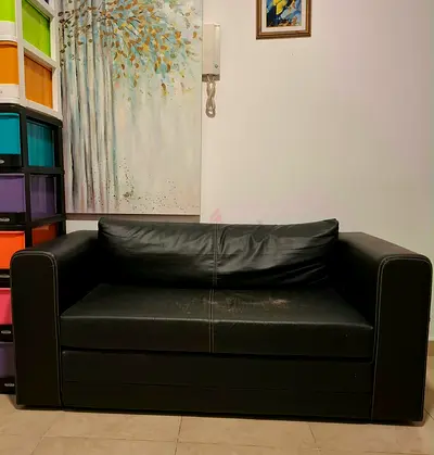 IKEA black 2-seater leather sofa - compact and sturdy