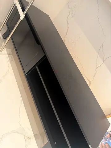 Black entertainment TV unit with open shelving