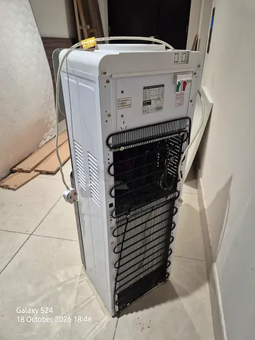 Used tall upright freezer / refrigerator (condensing coils at back) - working condition