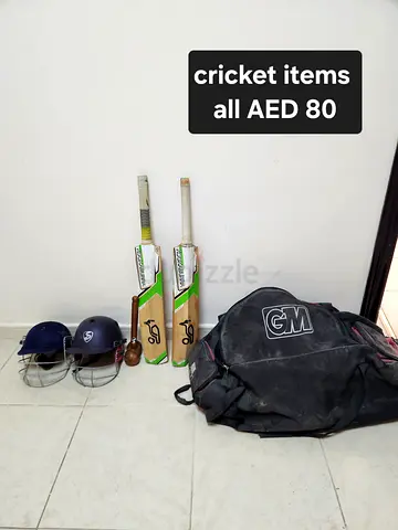 Cricket kit: 2 bats, 2 helmets, gloves, ball and large GM kit bag - AED 80