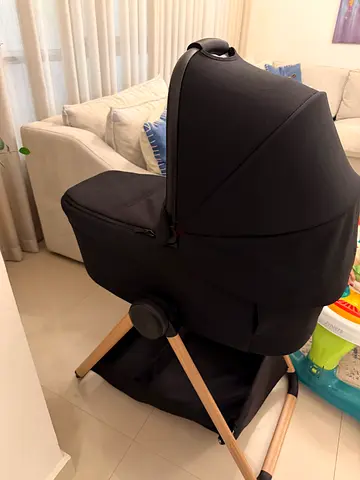 Lightweight black bassinet with wooden frame - good condition