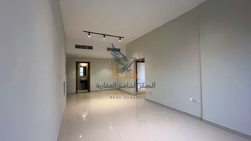 Spacious 2BR apartment for annual rent with central AC, 2 baths, balcony, built in wardrobes, prime location, and ready to move in now
