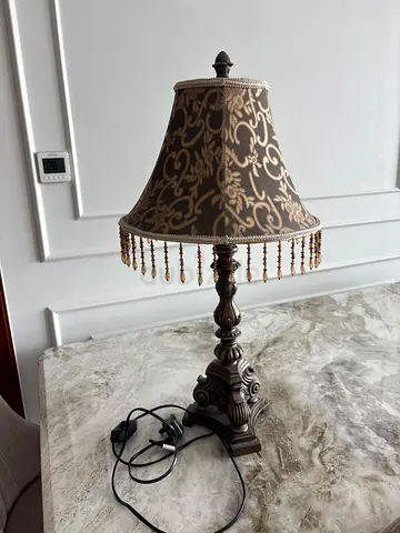 Ornate vintage-style table lamp with beaded fringe shade