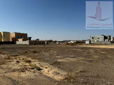 Residential-commercial land for sale in Masfout 8, Ajman. Plot 1543, 324 sqm, one street, ground an