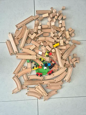 Large wooden train set with rails and building blocks