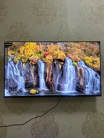 46–50 inch LED TV in good working condition — wall-mounted