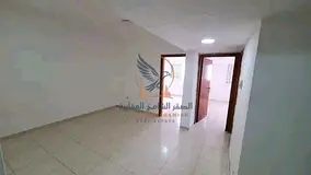 Two-bedroom apartment with a living room for monthly rent, unfurnished and without post-dated checks