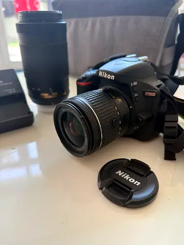 Nikon D5600 DSLR camera body with two lenses and accessories