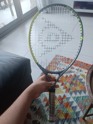 Used Dunlop tennis racket - good condition, playable strings