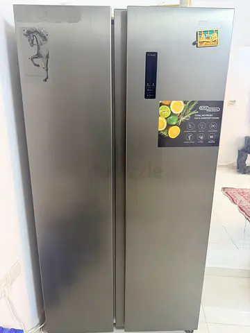Large stainless steel double-door refrigerator in excellent condition