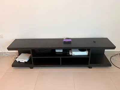 Low black TV console / entertainment unit - wide shelving