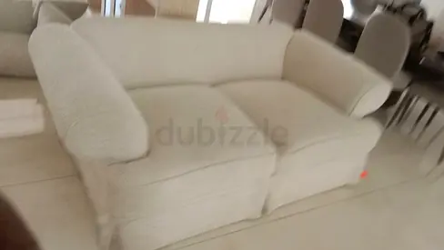 Cream Two-Seater Sofa with Removable Cushions