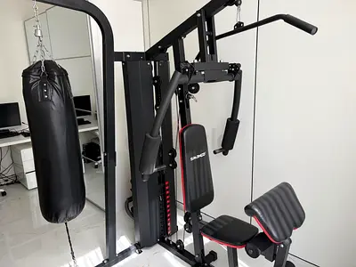 Home multi-gym station with punching bag - sturdy full body workout unit
