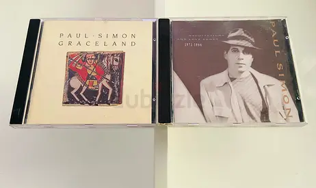 2 Paul Simon Music CD’s