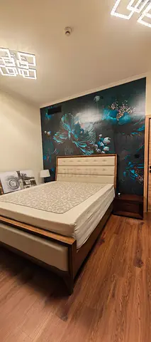 King bed frame and bedside tables without mattress