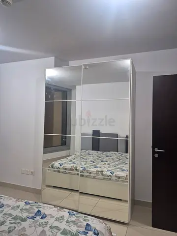 White mirrored sliding-door wardrobe with shelves - good condition
