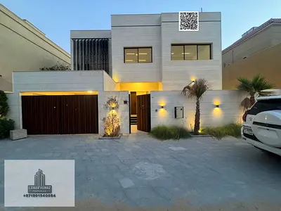 Villa for sale in Ajman Al Rawda, 5 master bedrooms, majlis, living room, and maid's room. Freehold ownership for all nationalities. Bank financing av