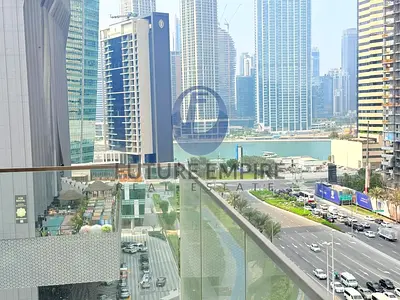 غرفة نوم واحدة في الخليج التجاري | إطلالة على البرج والقناة | شقة بشرفة