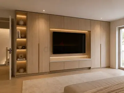 Custom built-in bedroom wardrobe with TV unit and shelving