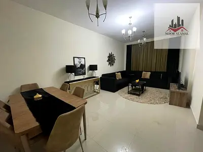 Sharjah, Al Taawun area: Two-bedroom apartment with a living room, kitchen, two bathrooms, and a balcony.