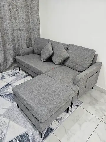 Light grey 3-seater sofa with ottoman — good condition