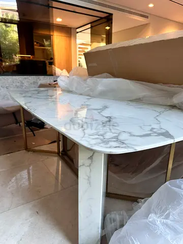 Marble-top dining table with gold metal legs - like new. No chairs