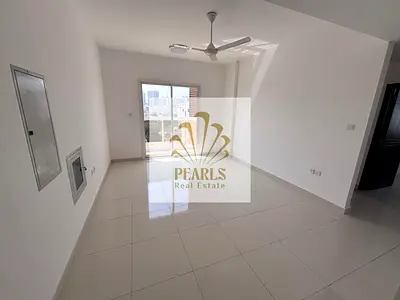 For annual rent in Al Rashidiya 2, Ajman: brand-new 3BR apartment, first tenant, 3 master bedrooms, 4 bathrooms, balcony, built-in wardrobes, open vie