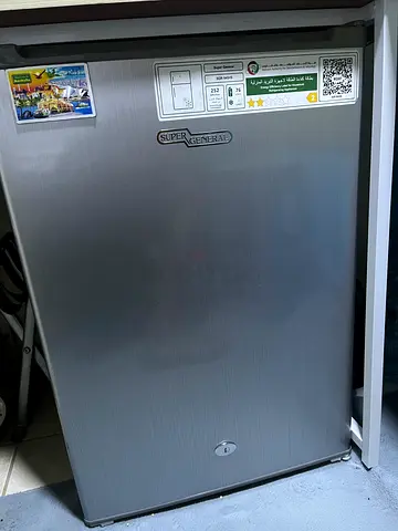 Compact single-door mini fridge — good condition