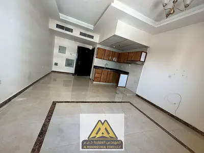 Spacious studio for rent in Al Rawda 2, Ajman, with a separate kitchen r. AED 23,000 yearly, 4 payments. Cheque deposit.