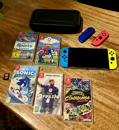 🎮 Nintendo Switch 1 + 6 Games + Extra Controllers + Carrying Case 💰 Price: AED 899 (Negotiable)