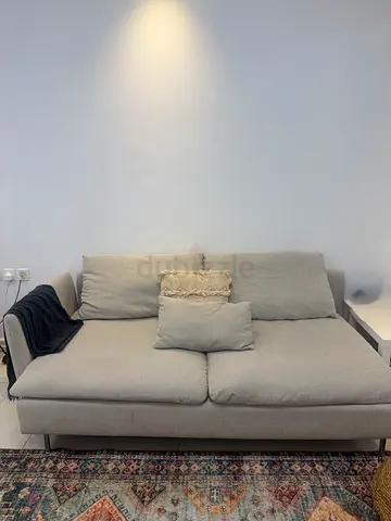 Light grey 2-seater sofa in good condition