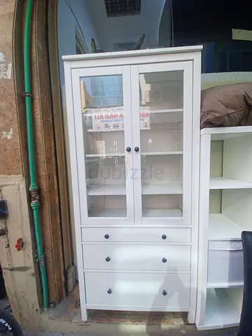 White Wooden Display Cabinet with Glass Doors and Drawers