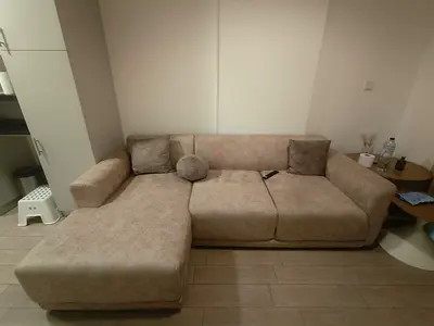 Light beige L-shaped 3-seater sofa with chaise, good condition