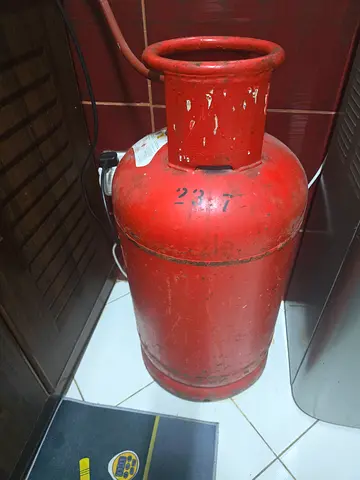 Used LPG Gas Cylinder - Standard Red Home Cylinder With Half Filled