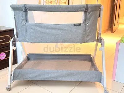 Giggles Gray bedside co-sleeper bassinet with storage lower shelf