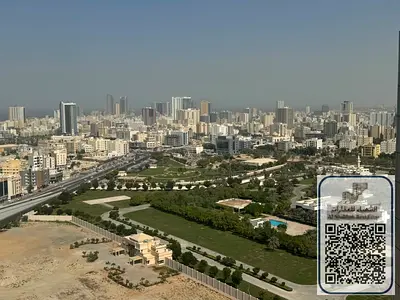 Family apartment with an open view, featuring two rooms and a living area, in City Tower, Ajman.