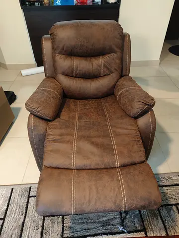 Brown reclining armchair with footrest - comfortable lounge chair