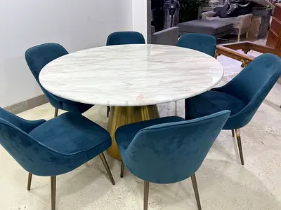 Table with marble top and 6 West Elm Chairs