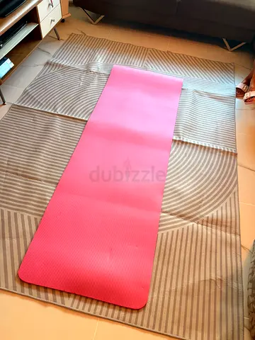 Lightly used pink yoga mat — good condition