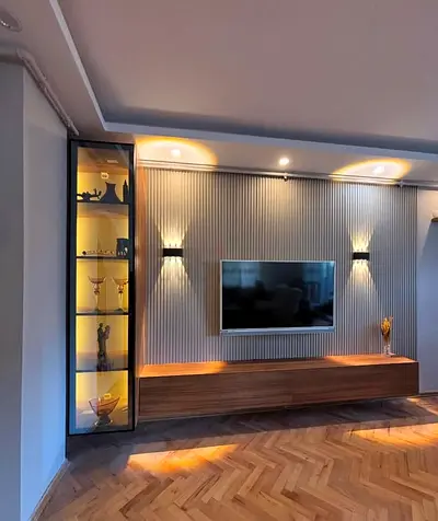 Modern wall-mounted TV unit with illuminated display cabinet — good condition
