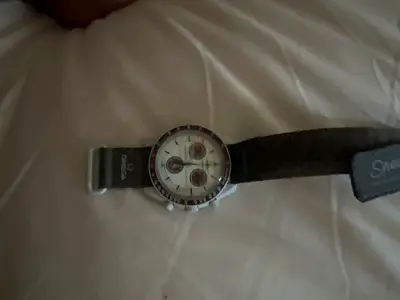 Used men's chronograph wristwatch with leather strap omega swatch mission to Pluto